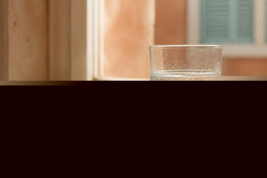 Glass of water on a sunlit windowsill